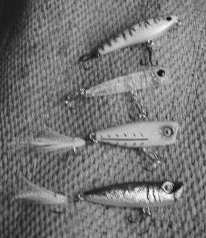 Surface lures for rivers, from top: the Big River Bait Puppy has an excellent walk-the-dog action and is hand made by Paul Kneller; the sinking Bassday Crystal popper resembles smelt or gudgeons; the Jackall SK Pop casts well and is equipped with rattles;